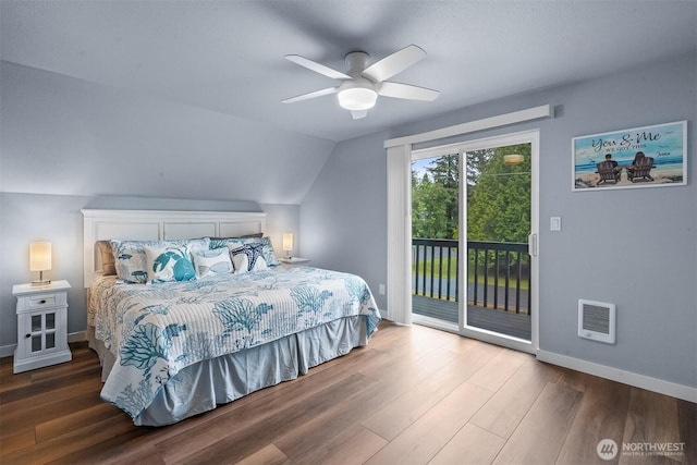 473 Mt Olympus Ave SE, Ocean Shores, WA 98569 - bedroom with access to exterior, wood finished floors, baseboards, vaulted ceiling, and a ceiling fan