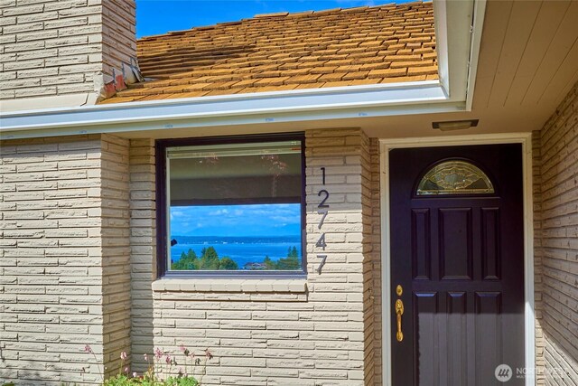 12747 9th Ave NW, Seattle, WA 98177 - property entrance with brick siding and a chimney