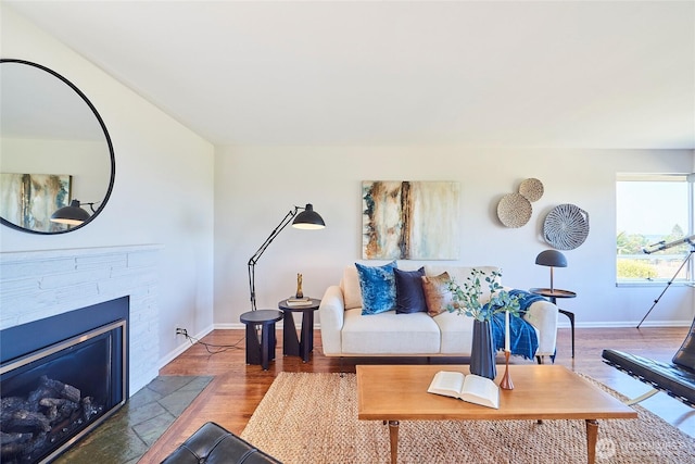 12747 9th Ave NW, Seattle, WA 98177 - living area with baseboards, wood finished floors, and a fireplace with flush hearth