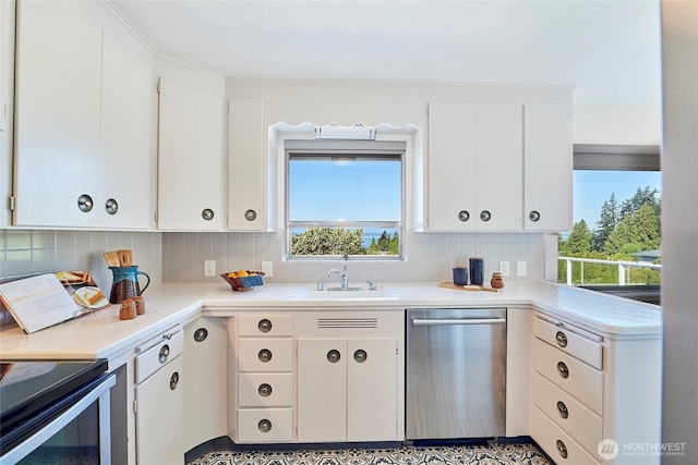 12747 9th Ave NW, Seattle, WA 98177 - kitchen with appliances with stainless steel finishes, a sink, tasteful backsplash, and white cabinets