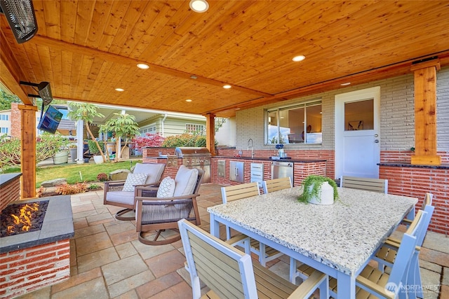 12747 9th Ave NW, Seattle, WA 98177 - view of patio / terrace with exterior kitchen, grilling area, a sink, and outdoor dining area