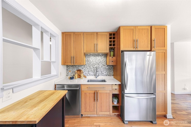 7503 24th Ave NE, Seattle, WA 98115 - kitchen with freestanding refrigerator, a sink, dishwasher, open shelves, and light wood-style floors