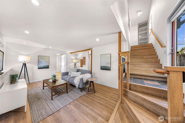 7503 24th Ave NE, Seattle, WA 98115 - living room with stairway, wood finished floors, baseboards, and recessed lighting