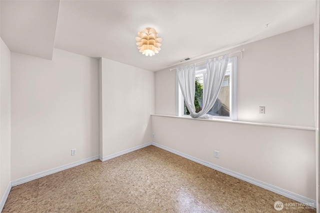 7503 24th Ave NE, Seattle, WA 98115 - spare room featuring baseboards