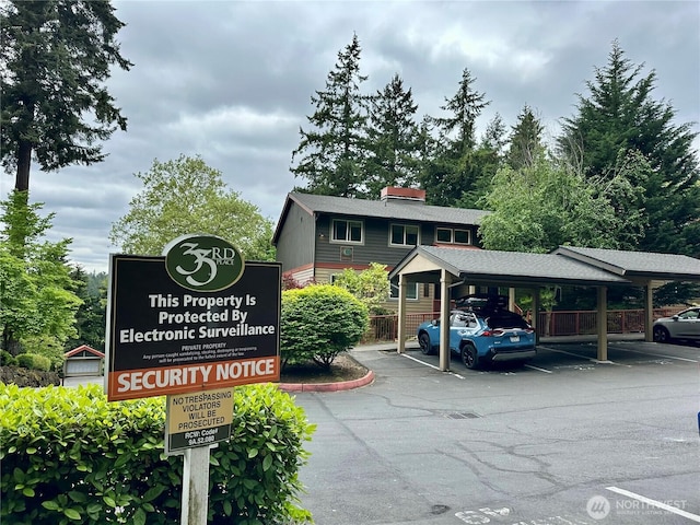 11054 NE 33rd Pl Unit B1, Bellevue, WA 98004 - exterior view of a parking lot, roof with shingles, and fence