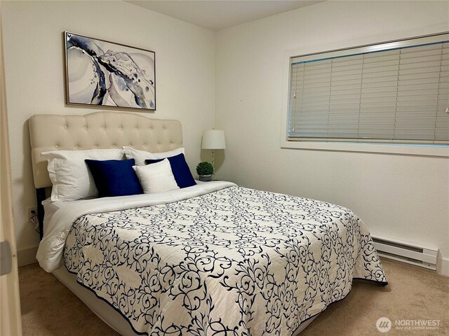 11054 NE 33rd Pl Unit B1, Bellevue, WA 98004 - carpeted bedroom with a baseboard heating unit