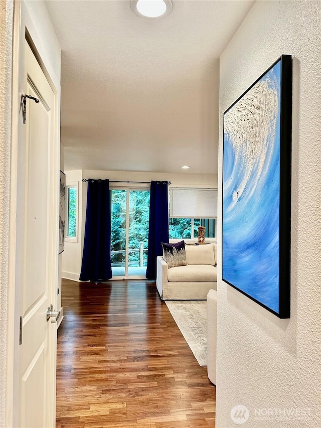 11054 NE 33rd Pl Unit B1, Bellevue, WA 98004 - corridor with wood finished floors and a textured wall