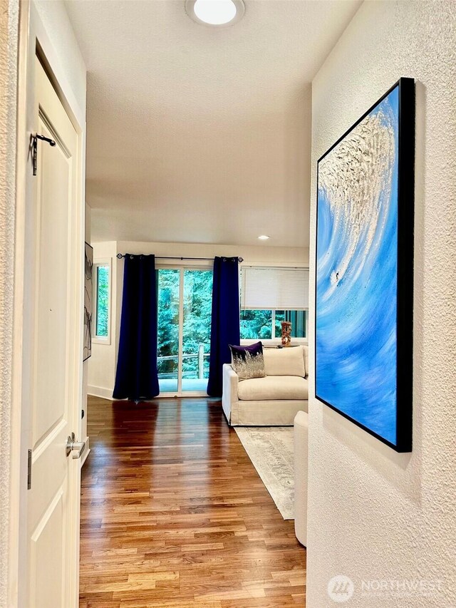 11054 NE 33rd Pl Unit B1, Bellevue, WA 98004 - living room featuring wood finished floors and a textured wall