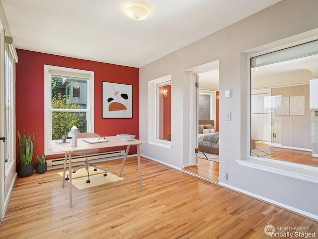 3226 Fuhrman Ave E Unit 201, Seattle, WA 98102 - home office with wood finished floors, baseboard heating, and baseboards