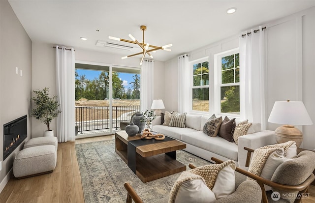 living area with recessed lighting and light wood-type flooring