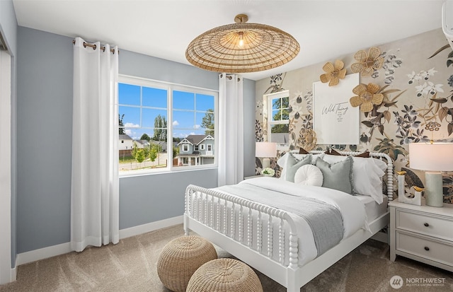 carpeted bedroom featuring baseboards