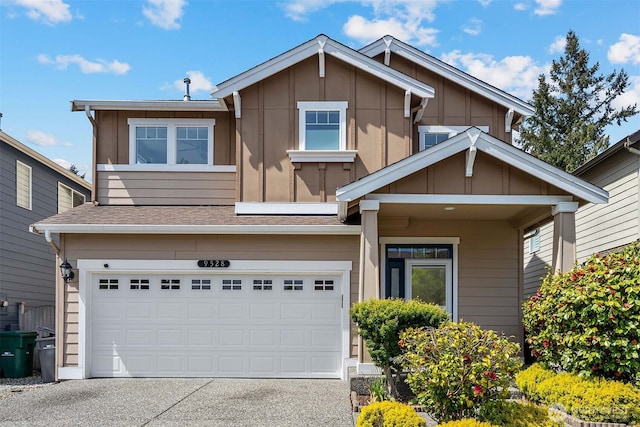 view of front of property featuring a garage, board and batten siding, and driveway