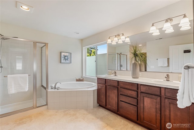 full bathroom featuring a garden tub, a shower stall, double vanity, and tile patterned flooring