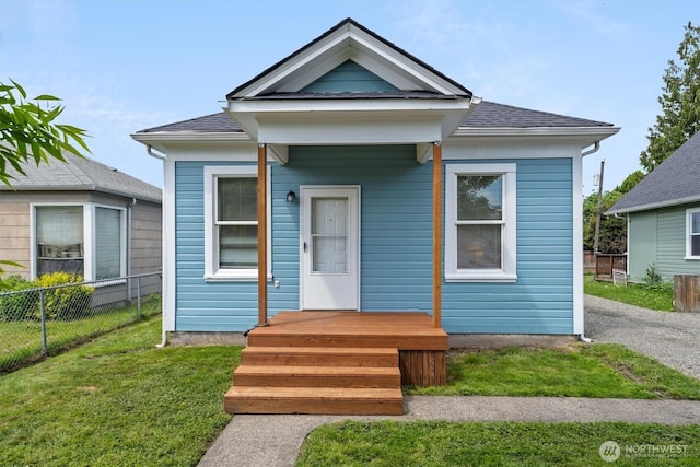 view of front of house featuring roof with shingles