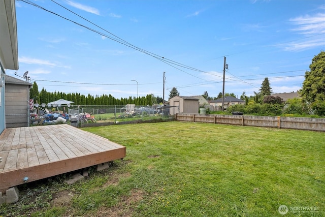 view of yard with a wooden deck