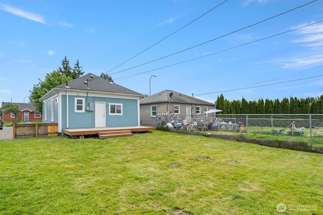 rear view of property with a deck