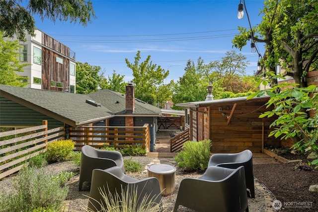view of patio with fence and a deck