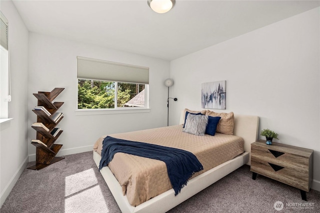 carpeted bedroom with baseboards