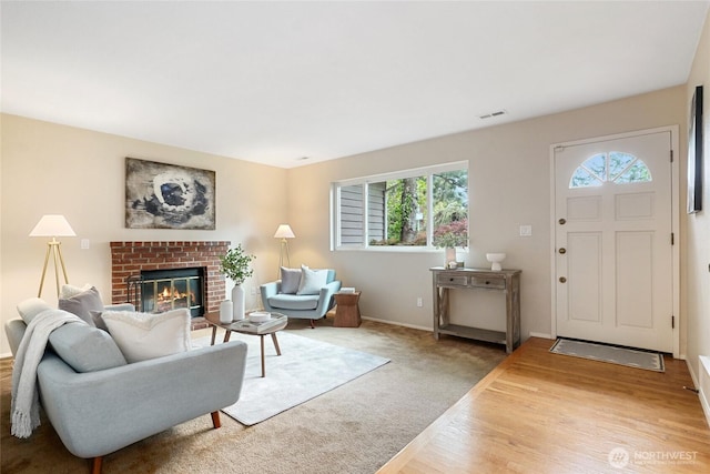 707 Harvest Rd, Bothell, WA 98012 - living room with a fireplace, baseboards, and wood finished floors