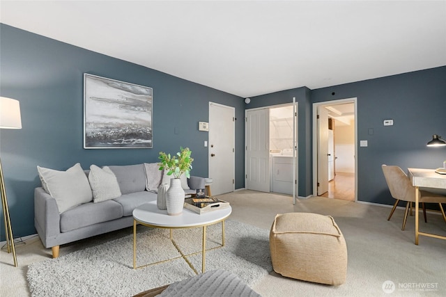 707 Harvest Rd, Bothell, WA 98012 - living room featuring carpet floors, washing machine and clothes dryer, and baseboards
