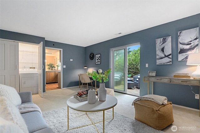 707 Harvest Rd, Bothell, WA 98012 - carpeted living area with washer / dryer and baseboards