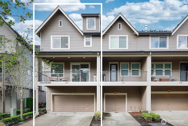 view of property with an attached garage and driveway
