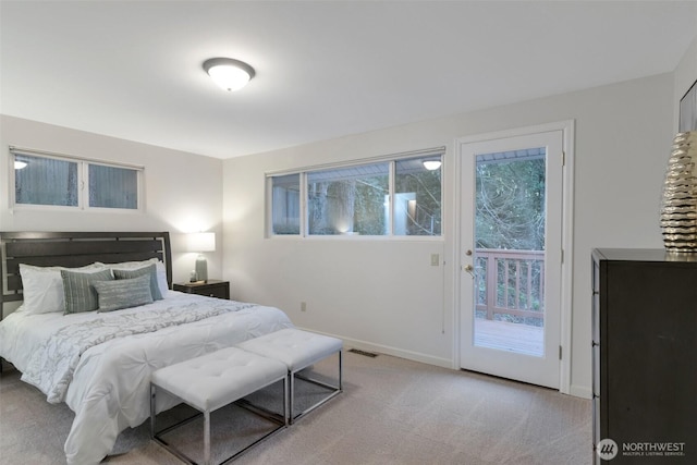 bedroom with light colored carpet, access to outside, baseboards, and visible vents