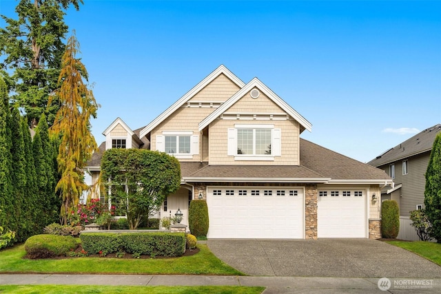 11758 175th Pl NE, Redmond, WA 98052 - view of front of home with stone siding, driveway, roof with shingles, and a garage