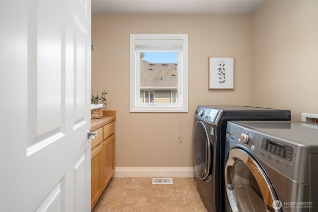 11758 175th Pl NE, Redmond, WA 98052 - laundry area featuring separate washer and dryer, baseboards, and cabinet space