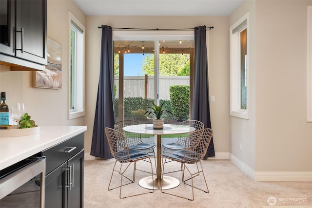 11758 175th Pl NE, Redmond, WA 98052 - dining room with beverage cooler, light colored carpet, and baseboards