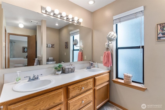 bathroom with ensuite bath and double vanity