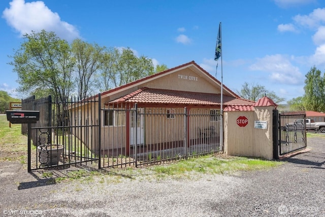 21058 State Highway 17 N, Soap Lake, WA 98851 - view of front of house featuring a gate and a tiled roof