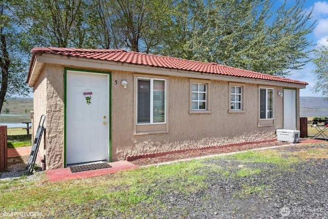21058 State Highway 17 N, Soap Lake, WA 98851 - view of front of property with stucco siding and a tiled roof