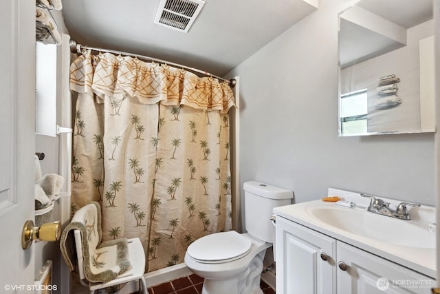 21058 State Highway 17 N, Soap Lake, WA 98851 - full bathroom featuring toilet, vanity, tile patterned floors, and a shower with shower curtain
