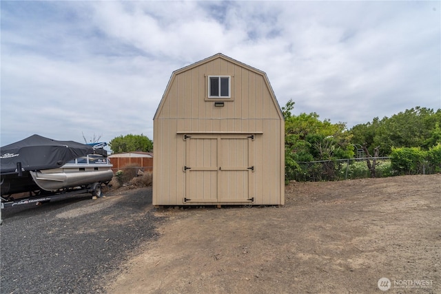 view of shed with fence