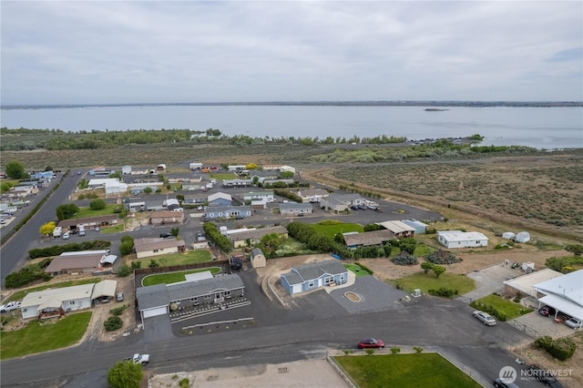 aerial view of residential area with a large body of water