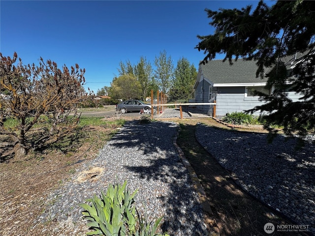 view of road featuring a gated entry and driveway