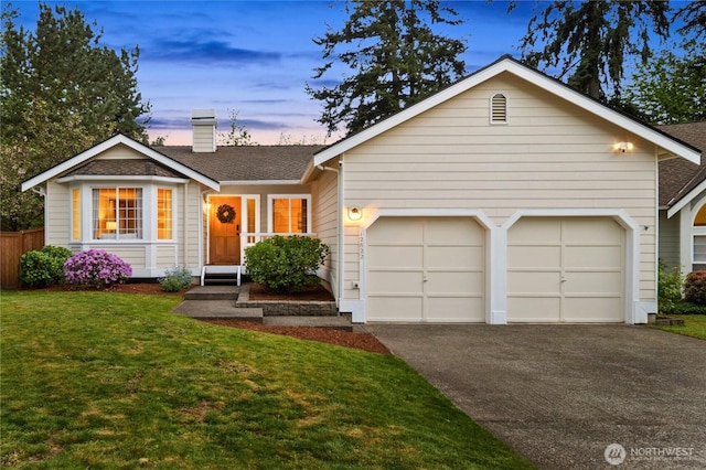 ranch-style home with driveway, a garage, a chimney, and a shingled roof