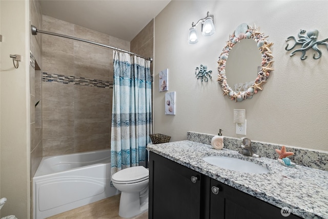 full bathroom with toilet, shower / bath combo, and vanity
