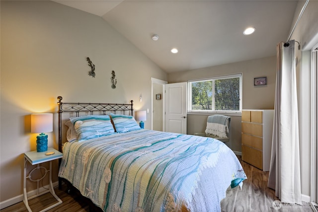 bedroom featuring wood finished floors, lofted ceiling, recessed lighting, and baseboards