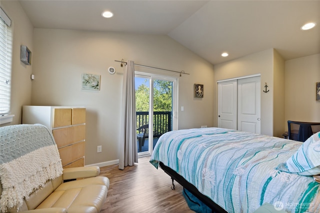 bedroom featuring access to outside, wood finished floors, lofted ceiling, baseboards, and recessed lighting