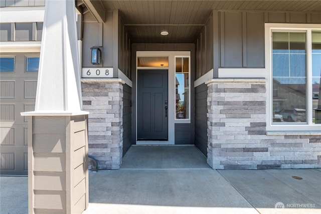 entrance to property featuring a porch and board and batten siding