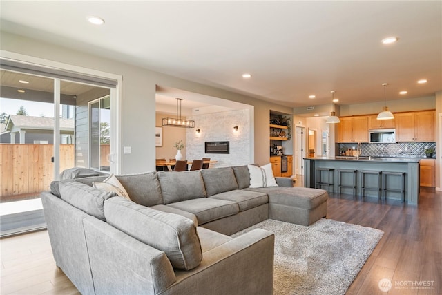 living room featuring wood finished floors and recessed lighting