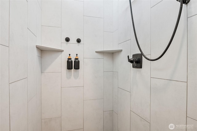 bathroom view of tiled shower