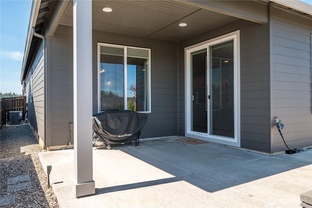 view of patio with central air condition unit and grilling area