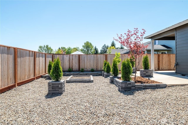 fenced backyard with a patio area