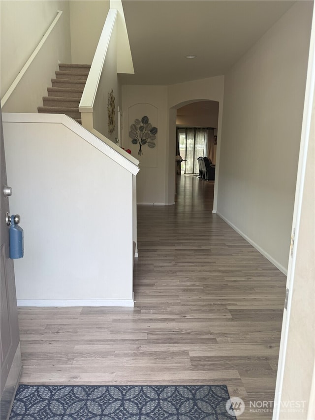 17510 80th Avenue Ct E, Puyallup, WA 98375 - corridor with arched walkways, baseboards, and wood finished floors