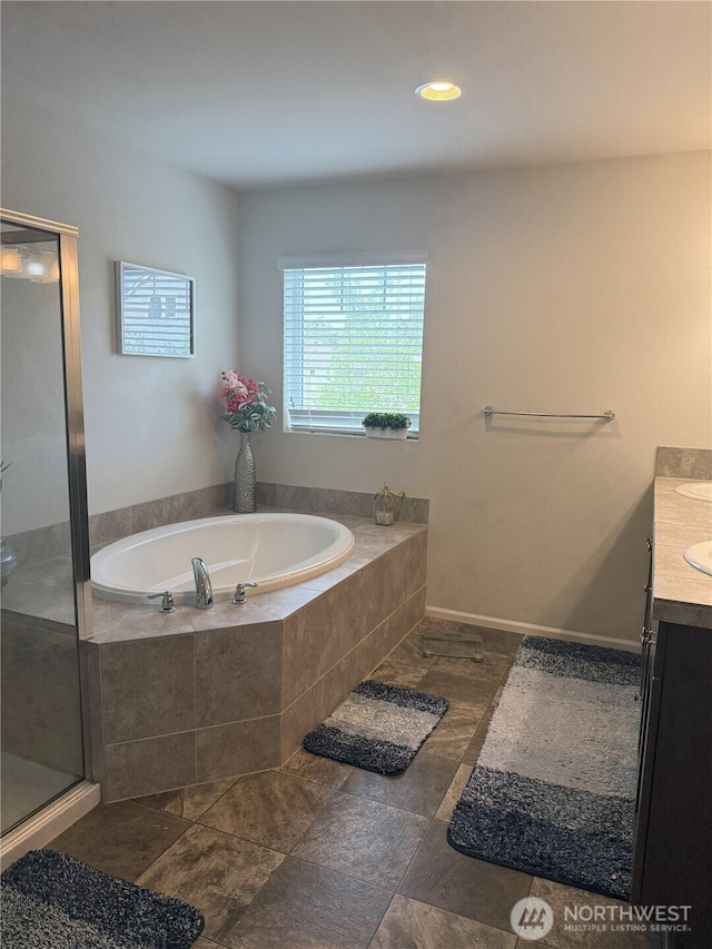 17510 80th Avenue Ct E, Puyallup, WA 98375 - bathroom featuring vanity, a shower stall, a bath, and recessed lighting