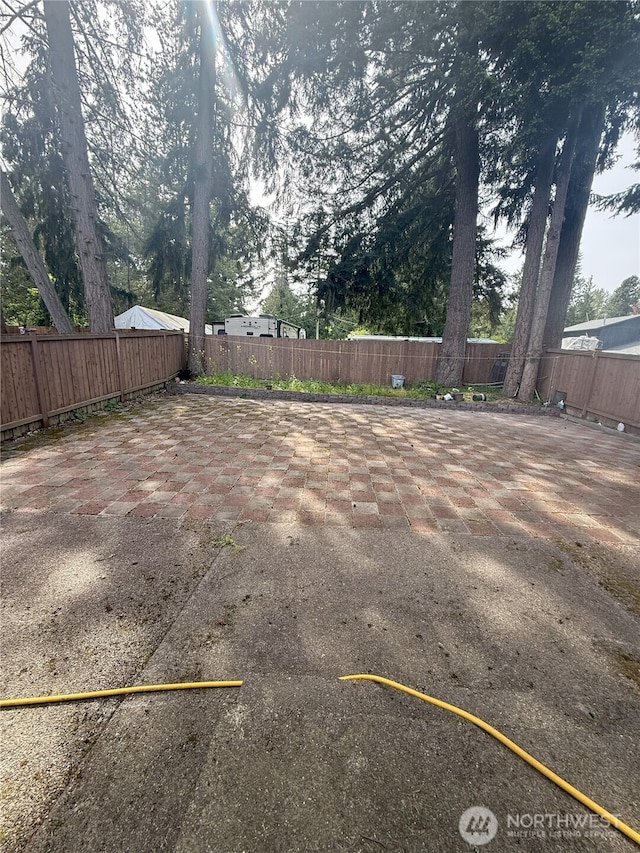 17510 80th Avenue Ct E, Puyallup, WA 98375 - view of yard featuring a patio area and a fenced backyard
