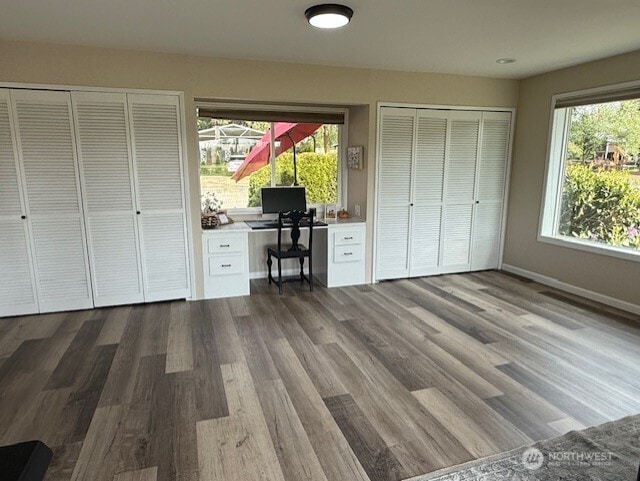 39418 200th Ave SE, Auburn, WA 98092 - bedroom with wood finished floors, baseboards, and two closets